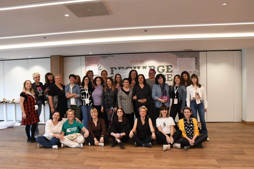 A group photo of participants in the conference room